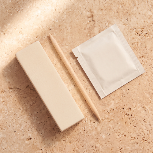 Nail file, wooden stick and prep wipe.