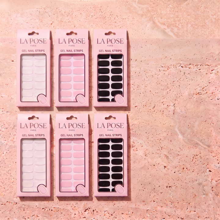 Six La Pose gel design cartons on warm stone